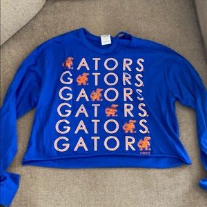 A blue long sleeve gator crop top from Pink.
